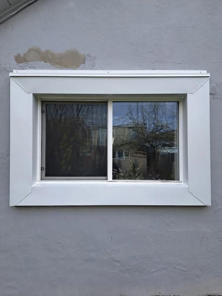 Same window wrapped in new white metal capping